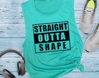 May include: A turquoise sleeveless shirt with the text "STRAIGHT OUTTA SHAPE" printed in black.
