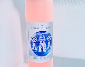 May include: A clear plastic bottle with a pink liquid inside. The label reads "LOVE SPIRITUAL BATH Mother's Mystic Water 236 ml | 8 fl oz."