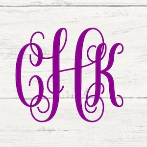 May include: A monogram design featuring the letters "G" "H" and "K" in a cursive font. The letters are in a purple color and are set against a white wood background.