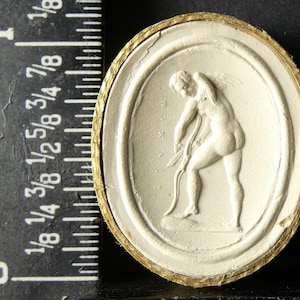 Antique grand tour circa 1820 plaster intaglio cameo 134 shows Cupid