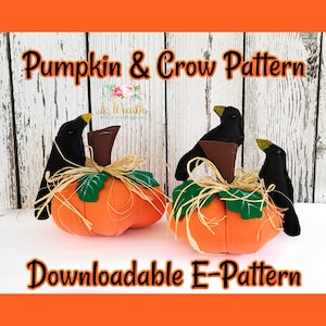 May include: A downloadable e-pattern for a felt pumpkin and crow craft project. The pattern includes two pumpkins with crows perched on top, one with a brown stem and the other with a green stem. The pumpkins are orange with green leaves and brown stems. The crows are black with yellow beaks.