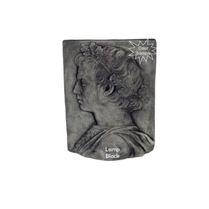 May include: A gray stone wall plaque with a bas-relief sculpture of a person wearing a crown of leaves. The plaque has the text "Lamp Black" at the bottom.