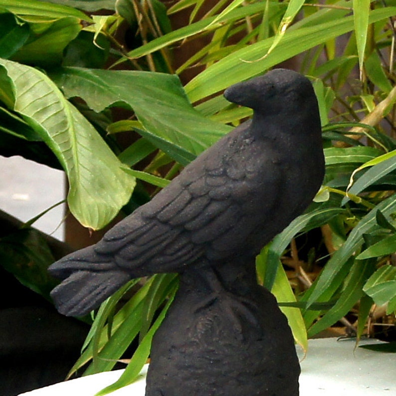 red raven resin statue