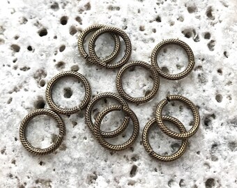 100 längliche Biegeringe in antik Bronze 5 x 4 mm