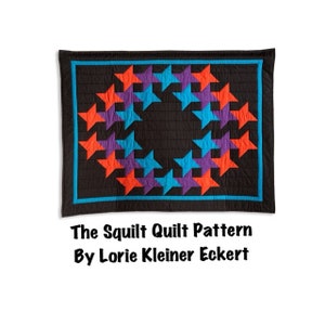 May include: A quilt pattern called "The Squilt Quilt Pattern" by Lorie Kleiner Eckert. The quilt features a circular design of orange, blue, and purple stars on a black background.