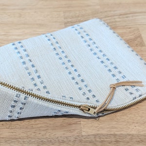 Modern ivory makeup pouch with sky blue stripes image 1
