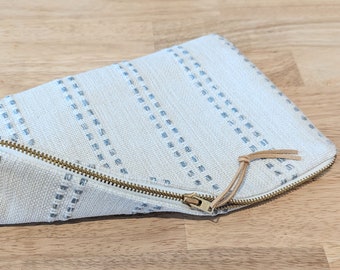 Modern ivory makeup pouch with sky blue stripes