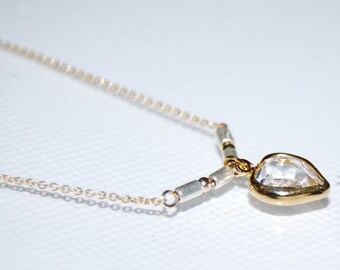 Chain, pendant and small balls in Gold Filled 14 carats. 925 Silver tubular beads and Crystal Swarovski heart pendant.