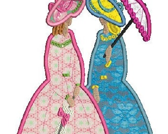 May include: An embroidered design featuring two women in Victorian-style dresses and hats. One woman wears a pink dress with a matching hat and holds a parasol. The other woman is in a blue dress with a yellow hat and a pink parasol. The design has a white background.