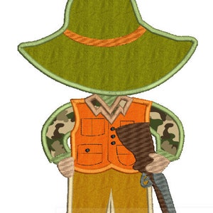 May include: An embroidered design of a person wearing a green hat, orange waistcoat, camouflage trousers, and brown boots. The person is holding a brown and grey shotgun.