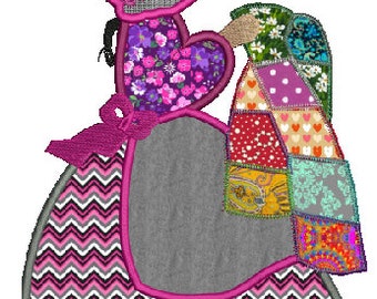 May include: A pink and gray patchwork doll with a pink hat and a patchwork quilt. The doll is wearing a pink and white chevron skirt.