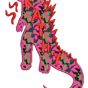 May include: Pink and green camouflage monster silhouette with the name "Kathy" written in red dripping letters.