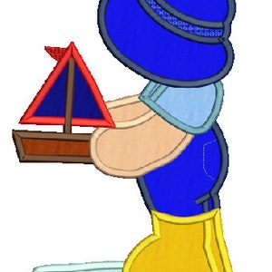 May include: A cartoon illustration of a figure in a blue hat and overalls, wearing yellow wellington boots, holding a toy sailboat with a red sail. The figure is standing in a puddle of water, with a light blue outline.