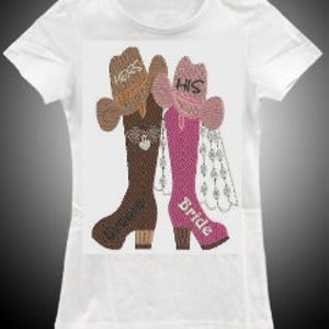 May include: A white t-shirt with a design of two cowboy boots, one brown and one pink, with cowboy hats on top. The brown boot has the text "Bride" and the pink boot has the text "His Bride".
