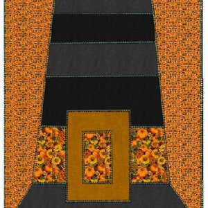 May include: A black and gray witch hat with a brown brim and a floral print on the inside. The hat is on a background of orange and white.