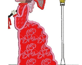 May include: An embroidered design of a woman in a red floral dress, holding a parasol. The dress has a pink trim and a floral pattern. A street lamp is in the background. The woman's hat and parasol have a lace design.