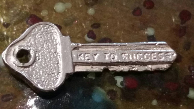 Vintage sterling silver key to success charm