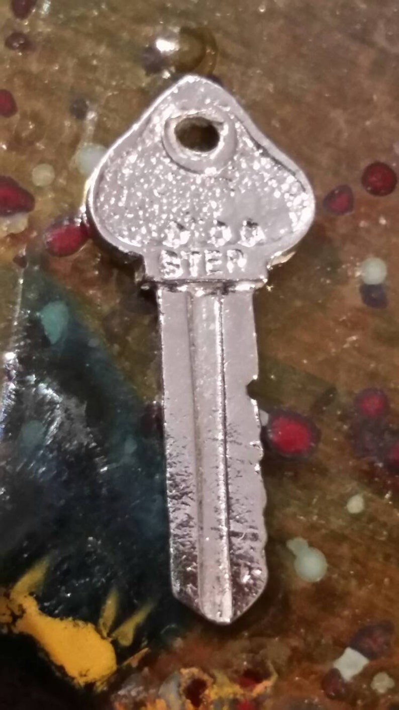 Vintage sterling silver key to success charm