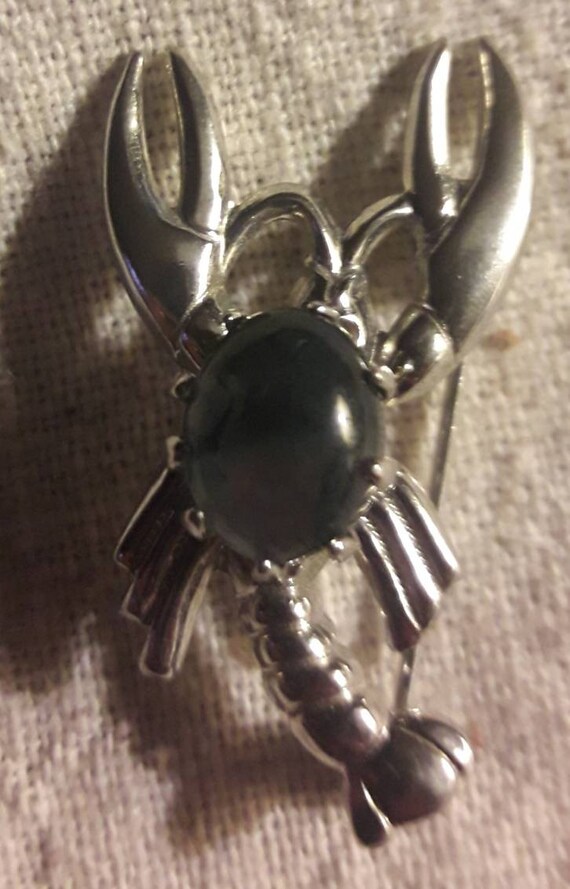 Silver Tone Lobster Brooch With Swirling Black Sto