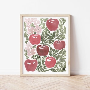 Może przedstawiać: Cyfrowa ilustracja czerwonych jabłek i r&oacute;żowych kwiat&oacute;w na białym tle. Jabłka są otoczone zielonymi liśćmi. Ilustracja jest oprawiona w jasną drewnianą ramę.