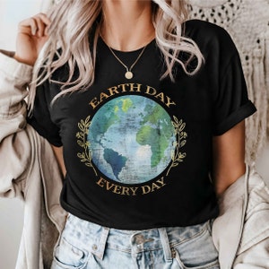 May include: A black t-shirt with a graphic of a blue and green earth with gold leaves and the text "Earth Day Every Day".
