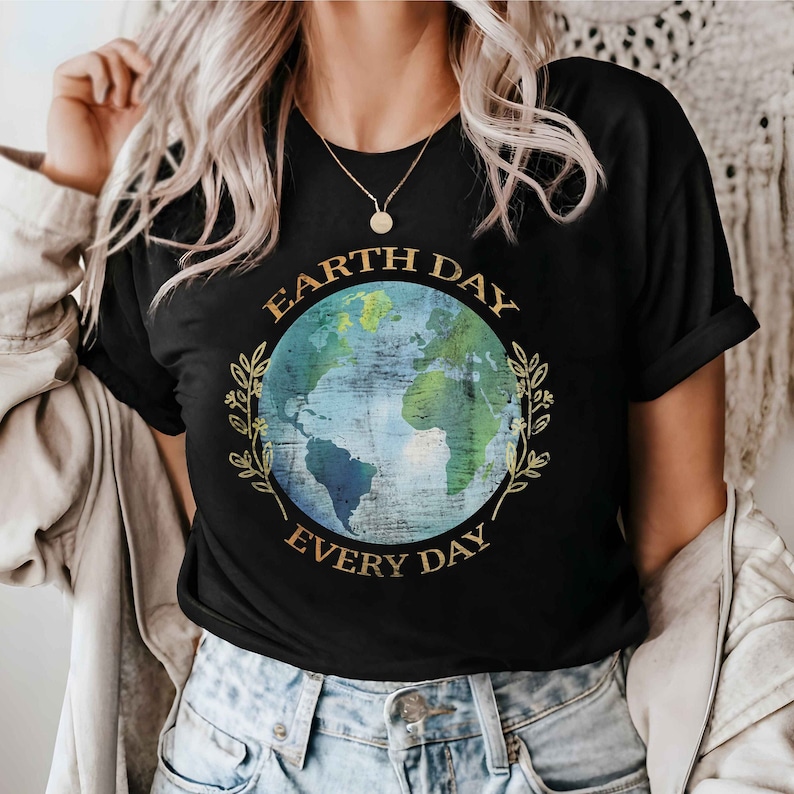 May include: A black t-shirt with a graphic of a blue and green earth with gold leaves and the text "Earth Day Every Day".