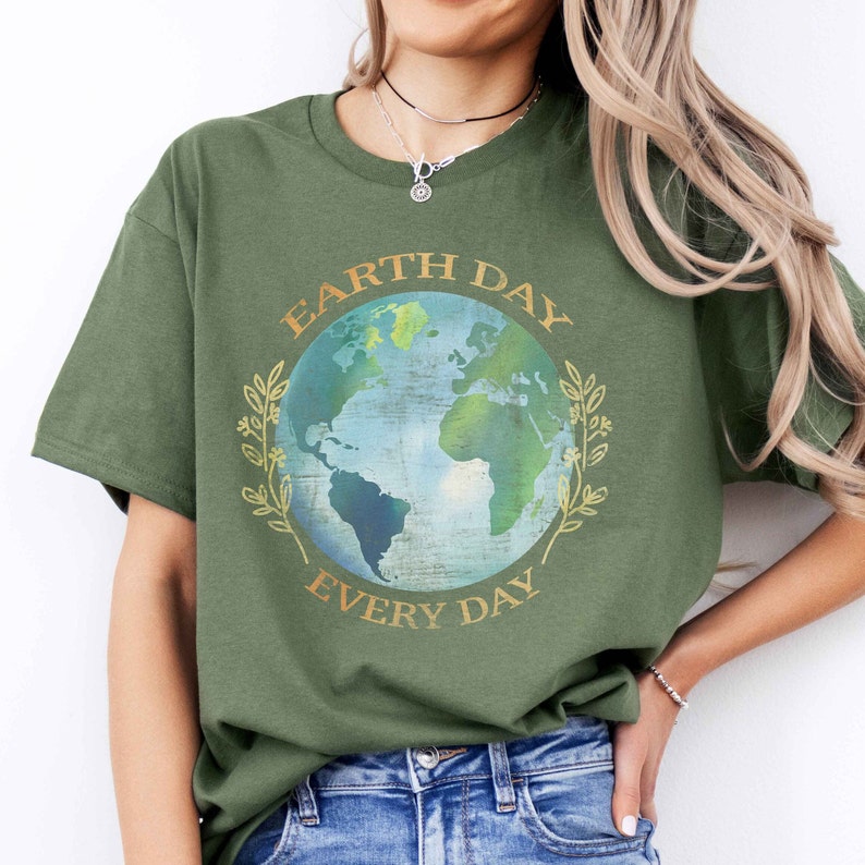 May include: A green t-shirt with a graphic of a blue and green earth with the text "Earth Day Every Day" in gold lettering.