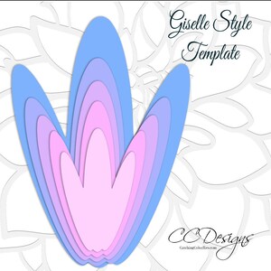 May include: A layered paper flower template in shades of pink and blue. The template is designed in a "Giselle Style" and is from CC Designs.