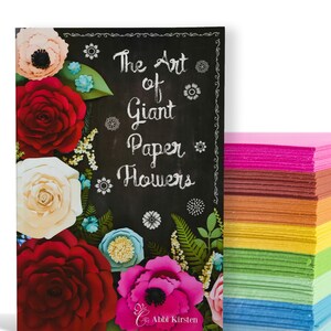 May include: A book cover with a chalkboard background featuring the text "The Art of Giant Paper Flowers" with colorful paper flowers in the foreground.