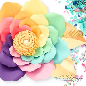 May include: A large paper flower with rainbow colored petals. The flower is made of multiple layers of paper, with the center being a yellow paper flower. The flower is on a white background with confetti.