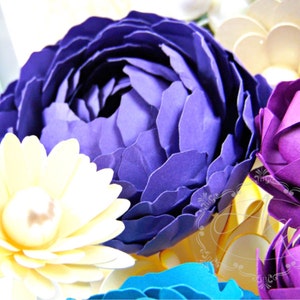 May include: A bouquet of paper flowers in shades of purple, yellow, and blue. The flowers are arranged in a vase and are a beautiful example of paper crafting.