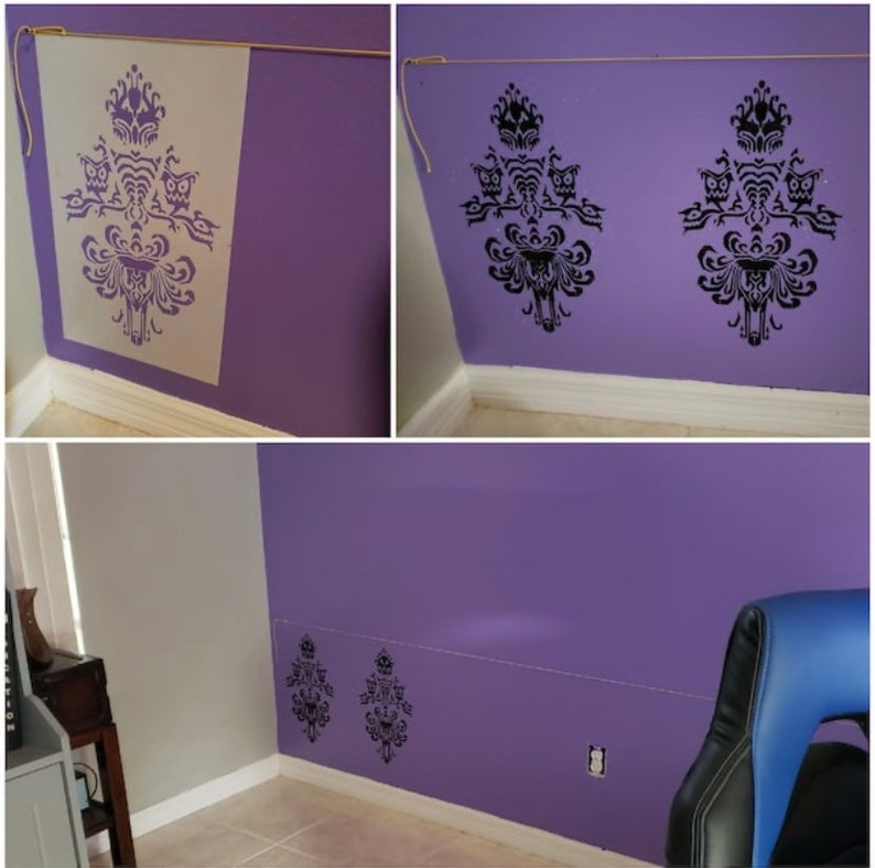 May include: A purple wall with a black and white stencil of a haunted house with owls. The stencil is repeated on the wall in different sizes and positions.