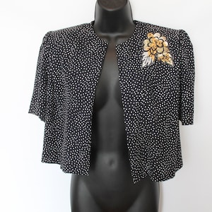 Black short-sleeved jacket with small white polka dots with embroidered flower Vintage Woman / La maison Carroll, Marguerite Cloutier/jacket