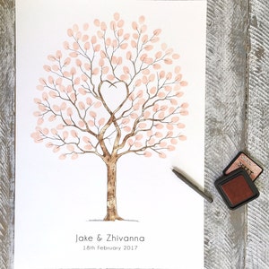 May include: A white card with a watercolour illustration of a tree with pink leaves and a heart-shaped branch. The text "Jake & Zhivanna 18th February 2017" is printed below the tree.