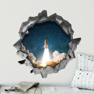 May include: A space shuttle blasts off into a starry night sky, breaking through a cracked concrete wall. The scene is depicted as a 3D wall decal.