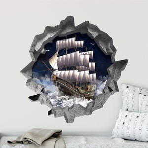 May include: A 3D wall decal featuring a vintage sailing ship with white sails, appearing to sail through a hole in a stone wall. The ship is sailing through a cloudy sky with stars visible in the background.