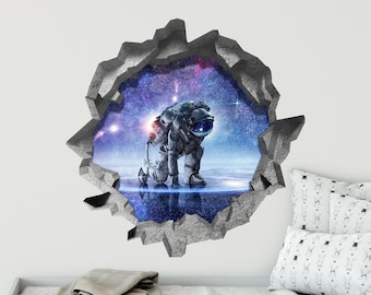 Könnte beinhalten: Ein 3D-Wandaufkleber mit einem Astronauten in einem Raumanzug, der in einer rissigen Wandöffnung steht, die eine Galaxie mit Sternen und Nebeln enthüllt.