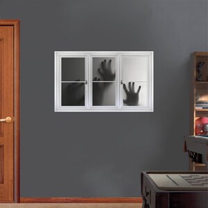 May include: A white window frame with three panes of glass. The glass is frosted and shows the silhouette of hands reaching through the glass.