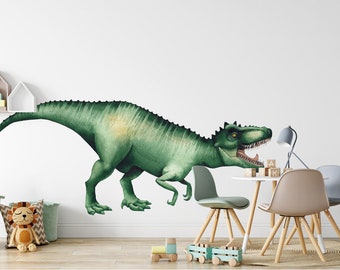 May include: A green dinosaur wall decal with an open mouth, placed on a white wall in a child's room. The decal is above a wooden table with chairs and toys.