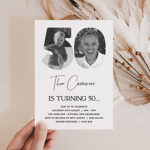 May include: Black and white photo birthday invitation for a 50th birthday party. The invitation features a photo of a man and a child in the number 50. The text reads "Theo Cameron is turning 50... Join us to celebrate Saturday 27th August | 6PM - 11PM CRU Wine Bar + Kitchen, Kew Melbourne RSVP to Belinda by 20th August | 0422 556 875 Dinner Provided | Cash Bar"