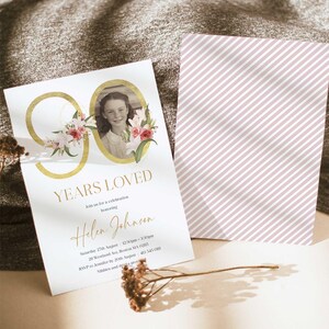 May include: A gold 90 with pink and white flowers around it. The number 90 is in a circle with a photo of a young girl inside. The text "YEARS LOVED" is below the number. The text "Join us for a celebration honoring Helen Johnson" is below the text "YEARS LOVED". The text "Saturday 27th August 12:30pm-3:30pm 20 Westland Ave, Boston MA 02115 RSVP to Jennifer by 20th August 403 545 0111 Nibbles and drinks provided" is below the text "Helen Johnson".