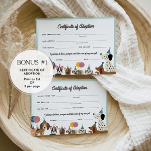 May include: Two printable certificates of adoption for a new pet. Each certificate has a space for the adopter's name, the pet's name, fur color, eye color, a signature line, and a date line. The certificates are decorated with cartoon dogs wearing party hats.