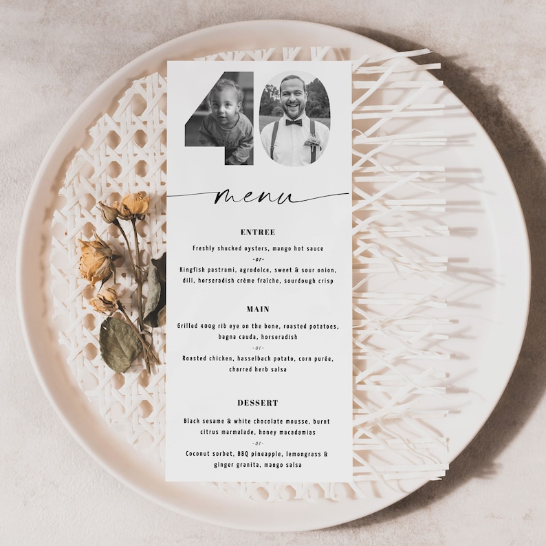 May include: A black and white menu card with the number 40 in a circle at the top. The menu lists the entree, main course, and dessert options for a 40th birthday party.