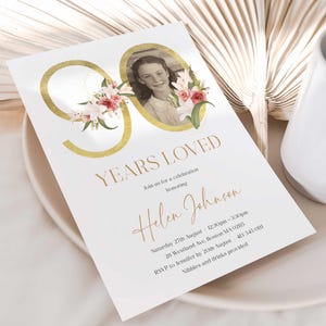 May include: Gold 90 with floral accents and a photo of a young girl. Invitation for a celebration honoring Helen Johnson. Saturday 27th August 12:30pm-3:30pm. 28 Westland Ave, Boston MA 02115. RSVP to Jennifer by 20th August 413 545 0111. Nibbles and drinks provided.