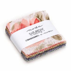 May include: A stack of fabric squares with a floral print in shades of pink, white, and green. The fabric is labeled "moda SATURDAY morning by BASICGREY for moda."