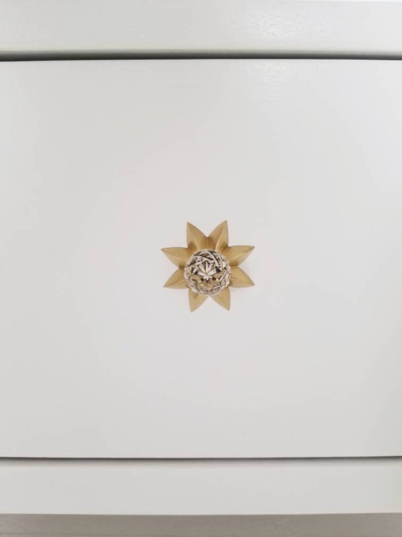 May include: A gold pineapple-shaped cabinet knob with a detailed design.