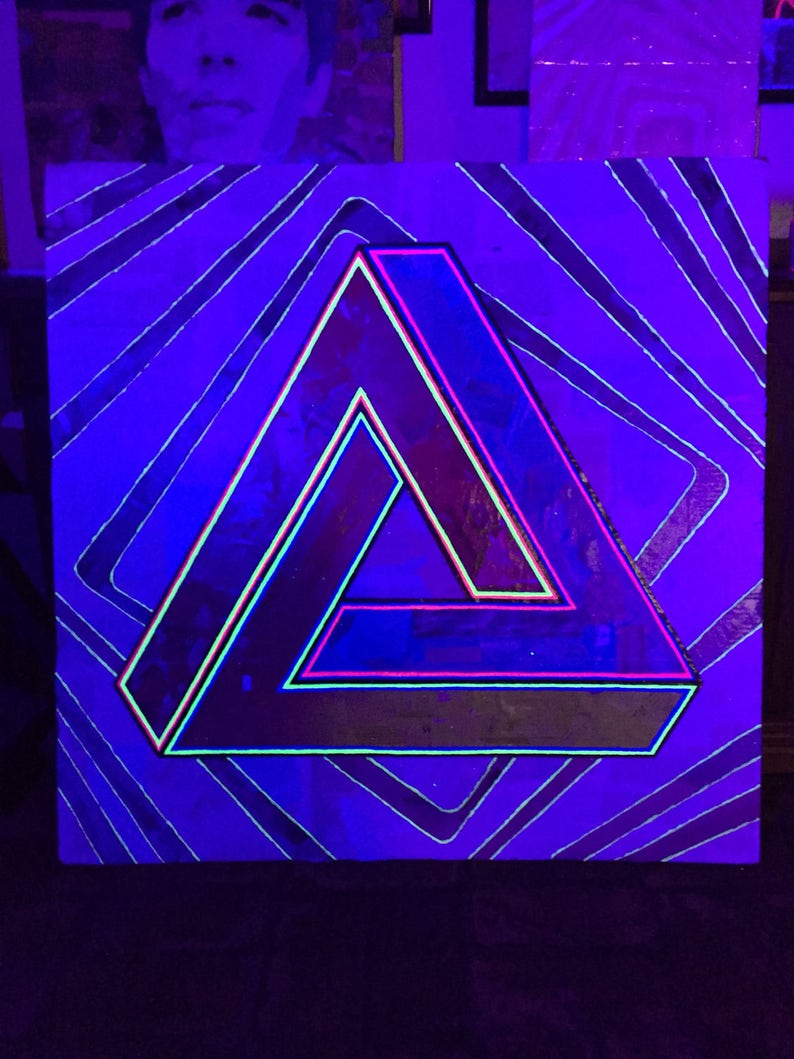 May include: A black canvas with a neon pink and green triangle illusion. The triangle is outlined in neon pink and green and is set against a background of black lines on a purple canvas.