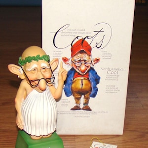 May include: A whimsical figurine of an elderly man in a toga, with glasses and a laurel wreath, standing on a green base. The base reads "Youth is wasted on the young!". A box with the word "Coots" and a cartoon character is behind the figurine.