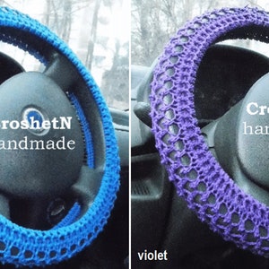May include: Two crocheted steering wheel covers, one blue and one purple. Both covers have a lacy design and the text "CroshetN handmade" is visible on each.