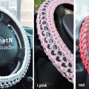 May include: Four crocheted steering wheel covers in different colors: white, pink, red, and yellow. The covers are made with a delicate, lacy pattern. The text "CroshetN handmade" is visible on the white cover.
